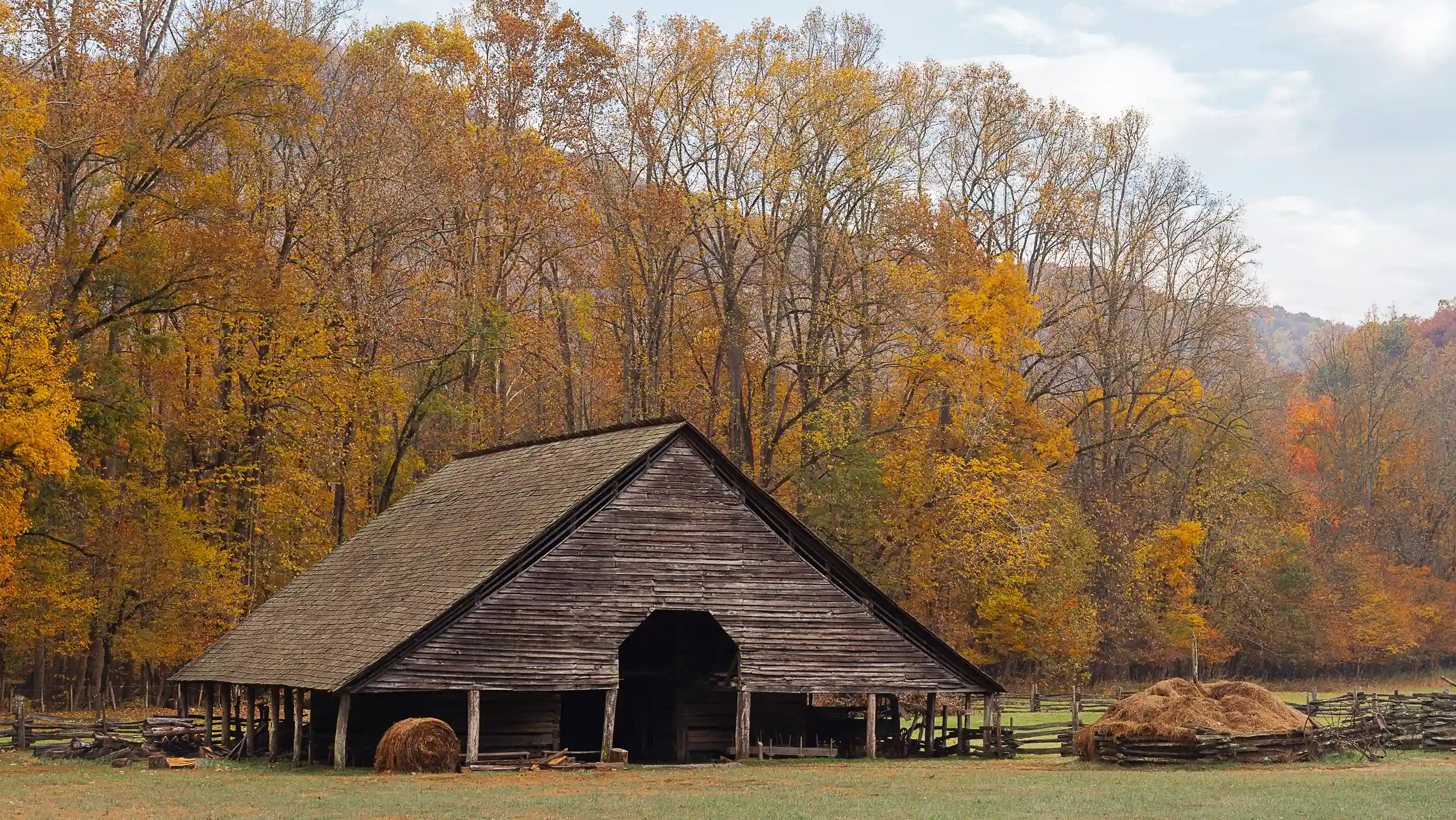 Cherokee Visitor Center with fall colors and hay bales in the Smoky Mountains