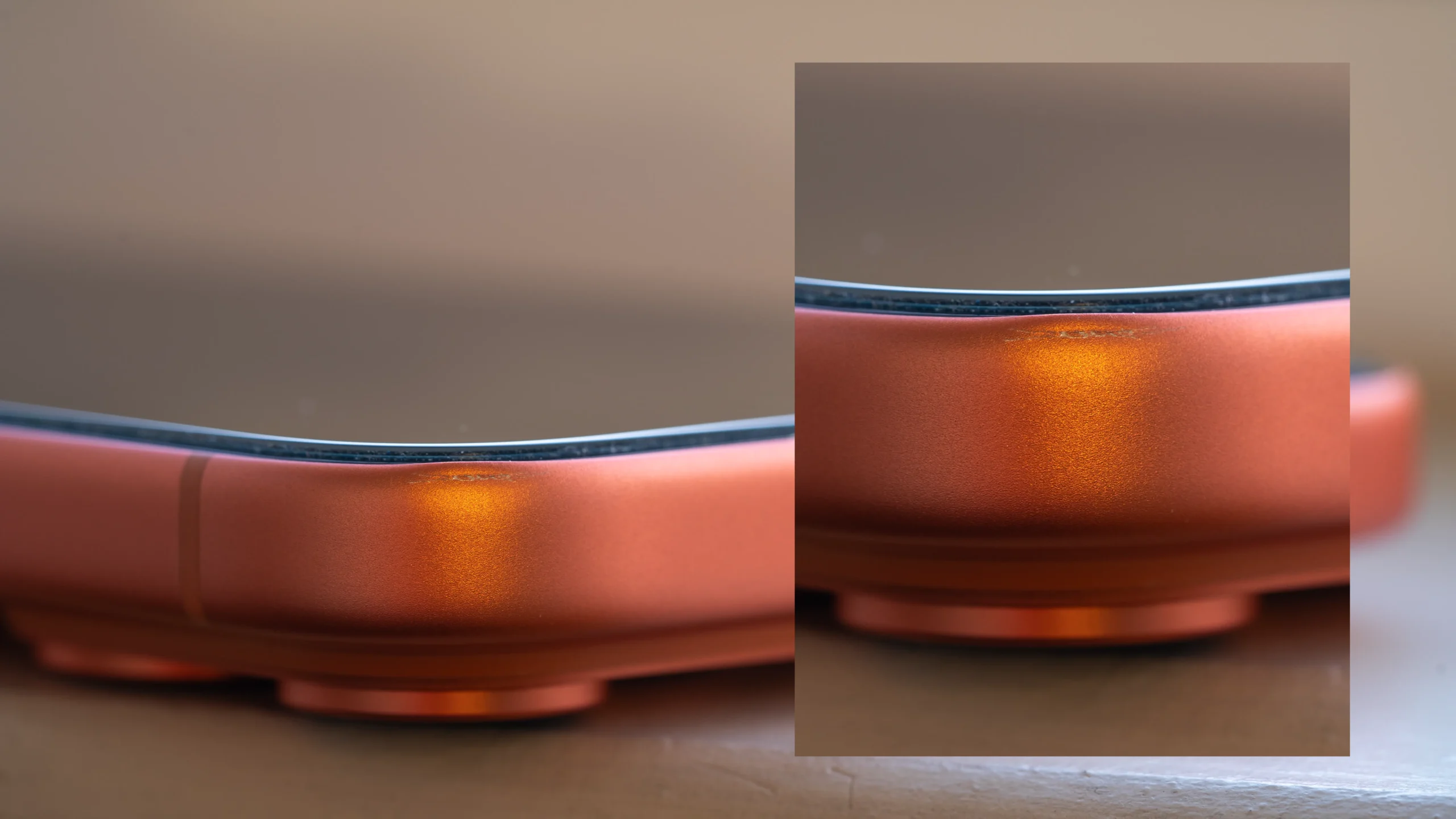 Close-up of iPhone 17 corner showing scratches and dents on the aluminum body, demonstrating durability issues.