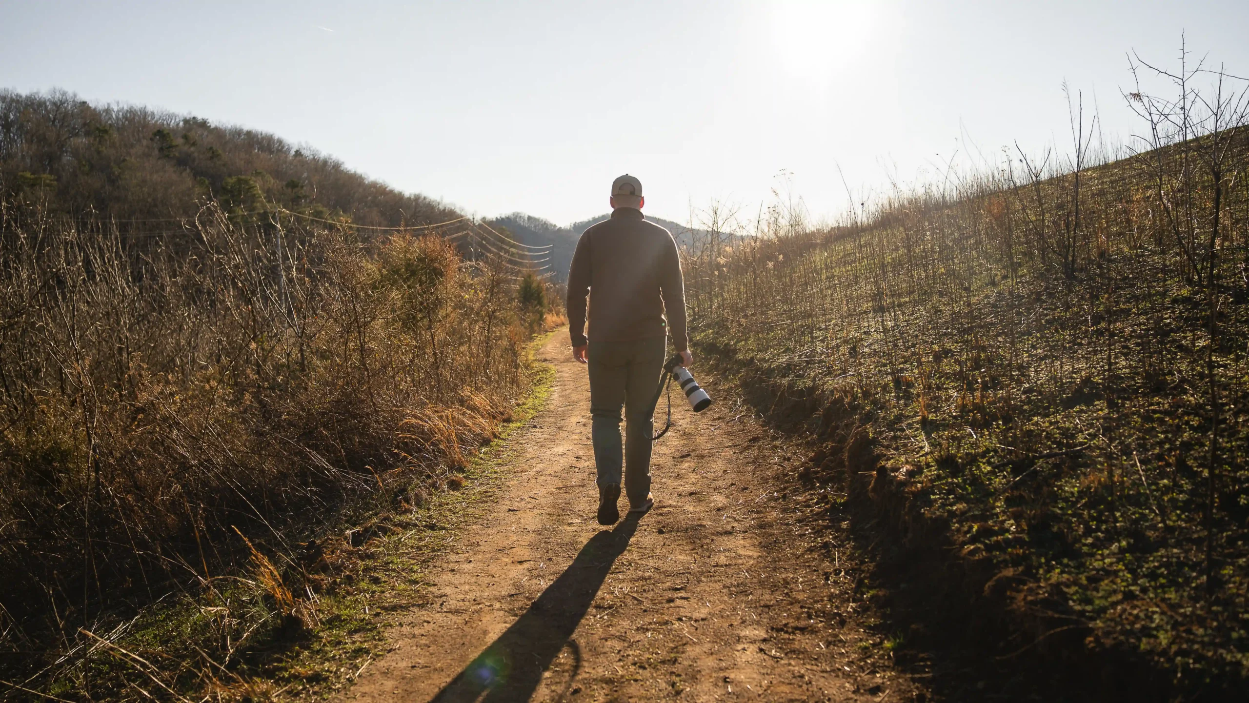 Walking at sunset with the Sony A7 V camera in hand