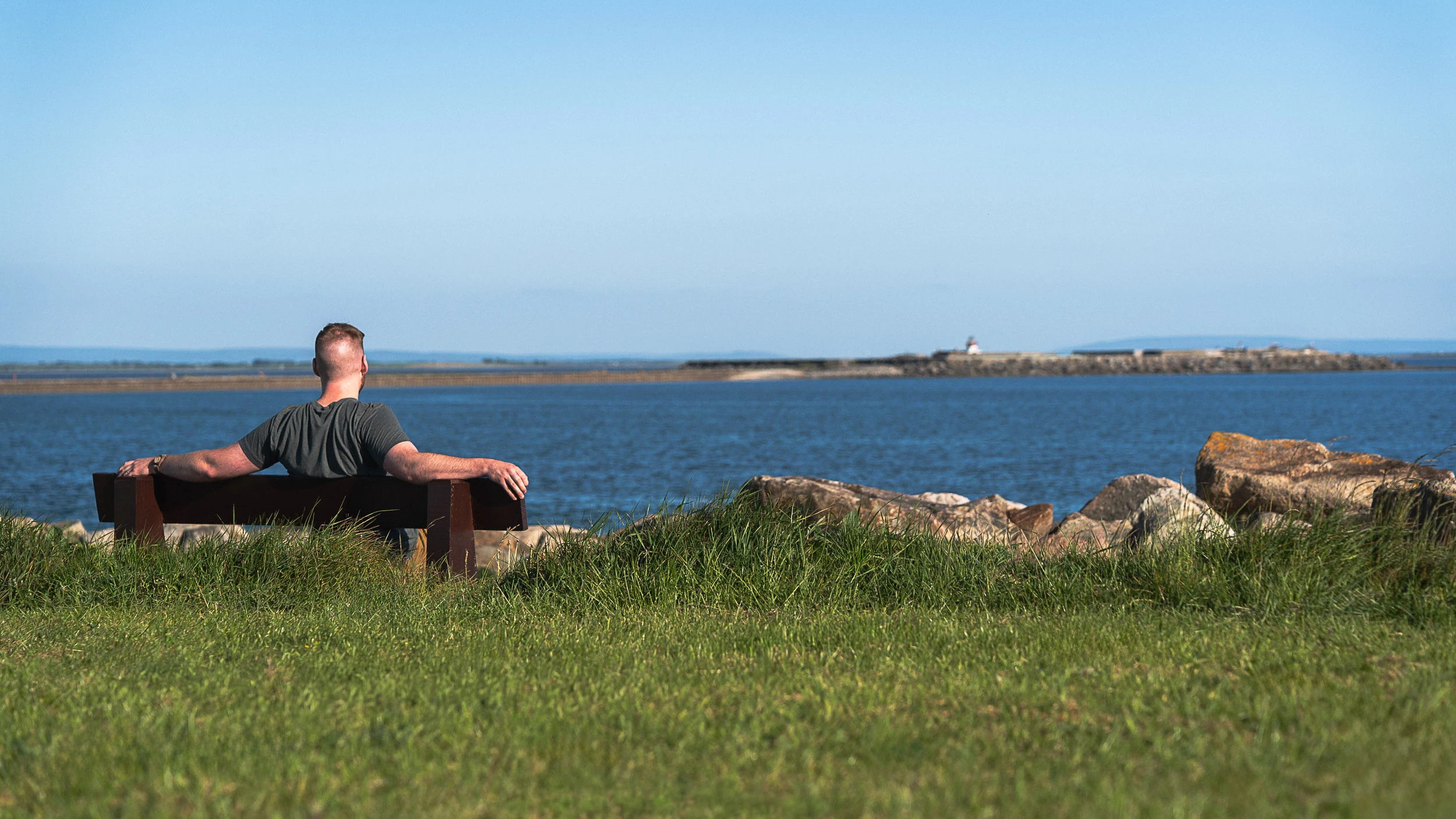 Visitor in Galway Ireland relaxing along the coast